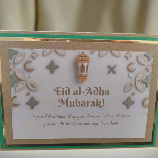 Handmade Eid al-Adha greeting card with decorative lantern and festive designs, wishing blessings from Allah.