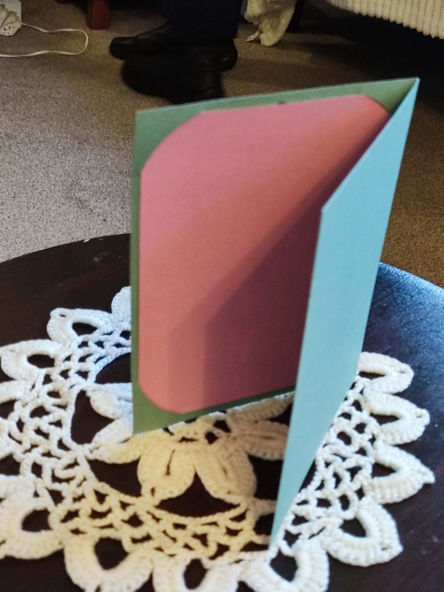 Handmade Easter greeting card featuring a pink and green cut-out design, showcasing a cheerful spring theme.