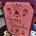 Handmade Diwali card with intricate cut-out design in pink and purple, featuring 'Happy Diwali' greeting.