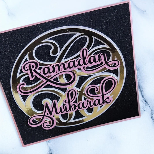 Handmade Glittery Ramadan Mubarak card with elegant script on a black background, perfect for celebrating Ramadan.