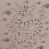 Illustration of a dragon surrounded by clouds, depicted in red and black on textured cardstock.