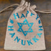 Drawstring Hanukkah hessian bag cinched at top with visible blue glitter Star of David and lettering