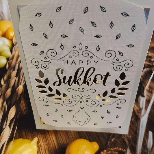 Happy Sukkot greeting card with intricate design and gold accents, perfect for holiday celebrations.