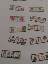 Colourful numbered labels for a Christmas advent calendar featuring festive designs and characters.