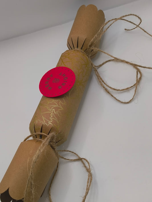 Eco-Friendly Christmas Crackers with gold holly design and jute twine for a rustic festive look.
