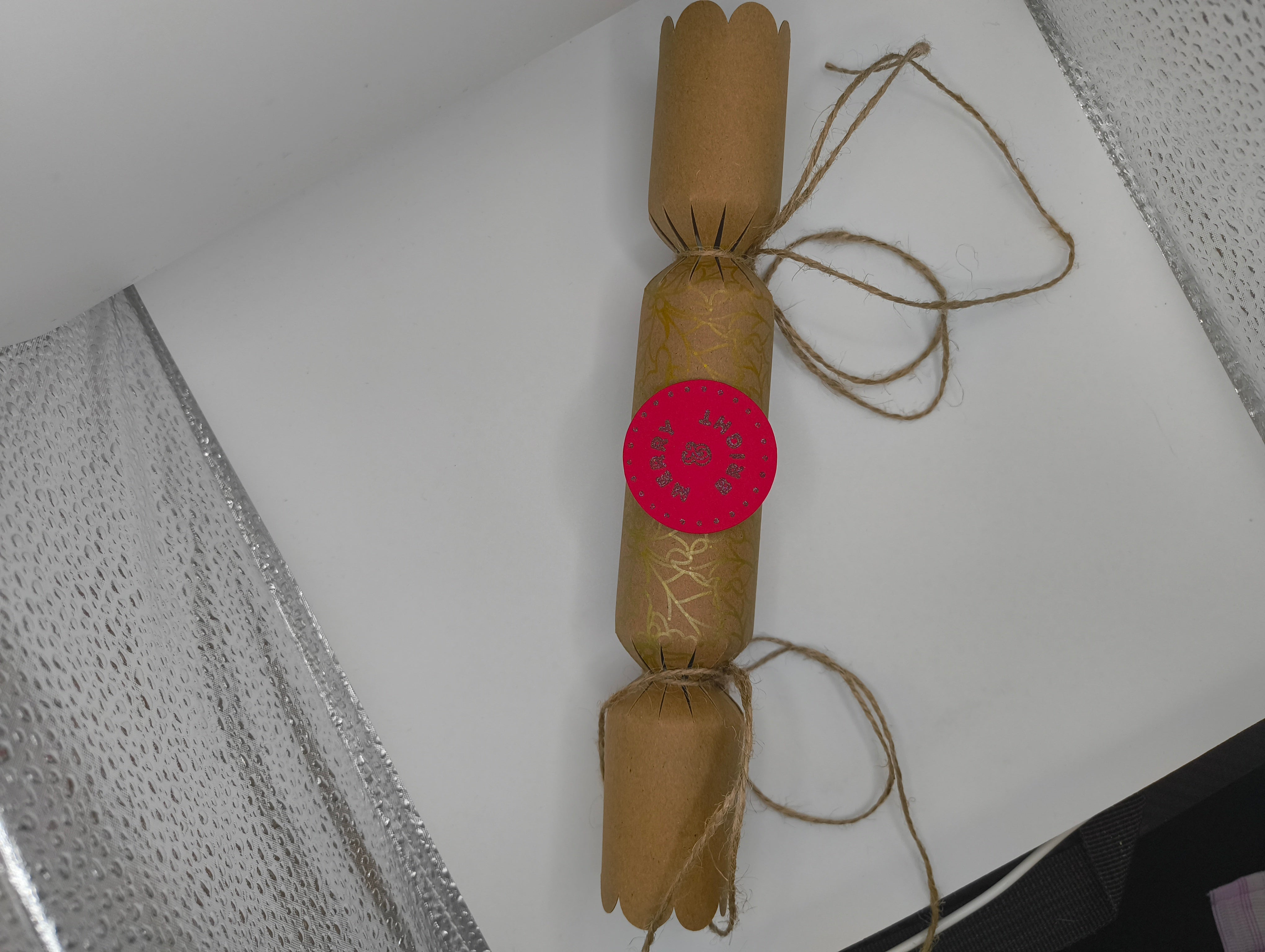 Eco-friendly Christmas crackers with gold accents and jute twine for a rustic festive touch.
