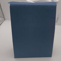 Back view of navy blue Ganesh gift box, handmade from premium textured cardstock with scalloped lid detail.