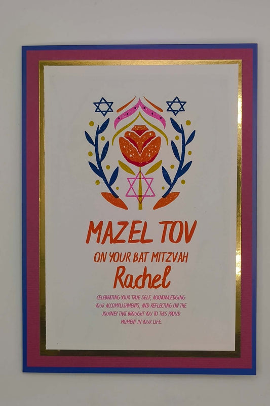 Handmade Bat Mitzvah card with floral Star of David design, Mazel Tov message, and personalised name Rachel. Layered cardstock in blue, pink, and gold foil border.