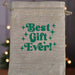 Hessian drawstring gift bag with green retro-style text reading