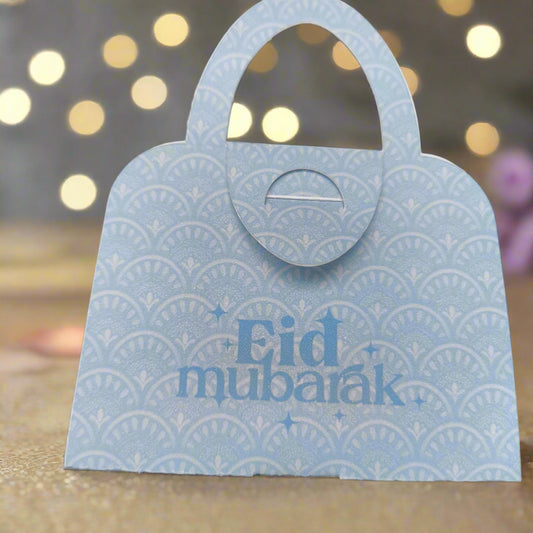 Blue patterned Eid Mubarak money holder in handbag design, ideal for stylish Eid gifting of money or vouchers.