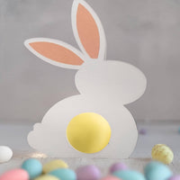 White Easter Bunny Chocolate Holder made of cardstock with personalized gold foil detail on the ear, designed to hold mini chocolate eggs or sweets.