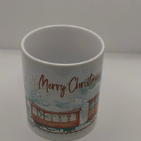 Ceramic Merry Christmas mug with festive train design studio photo