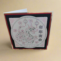 Dragon design Chinese New Year card featuring intricate illustrations and festive elements for Lunar New Year celebrations.