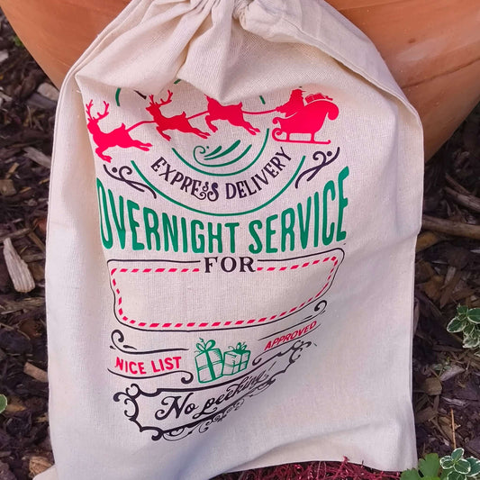 Close up of Christmas Santa sack showing overnight service and no peeking design.