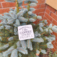 Funny coffee coaster gift with the phrase 'Sometimes I like coffee more than people' on a tree.