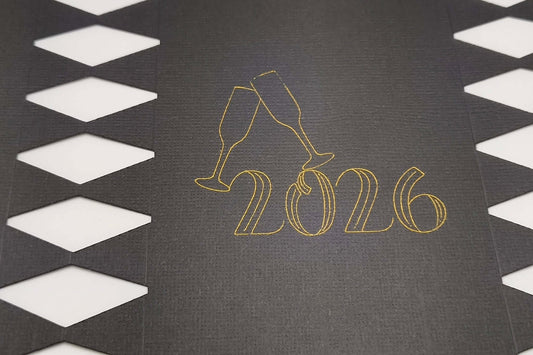 Personalised New Year cracker design featuring 2026 with champagne glasses on a black background.