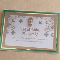 Handmade Eid al-Adha greeting card featuring gold accents and festive designs, perfect for celebrating the holiday.