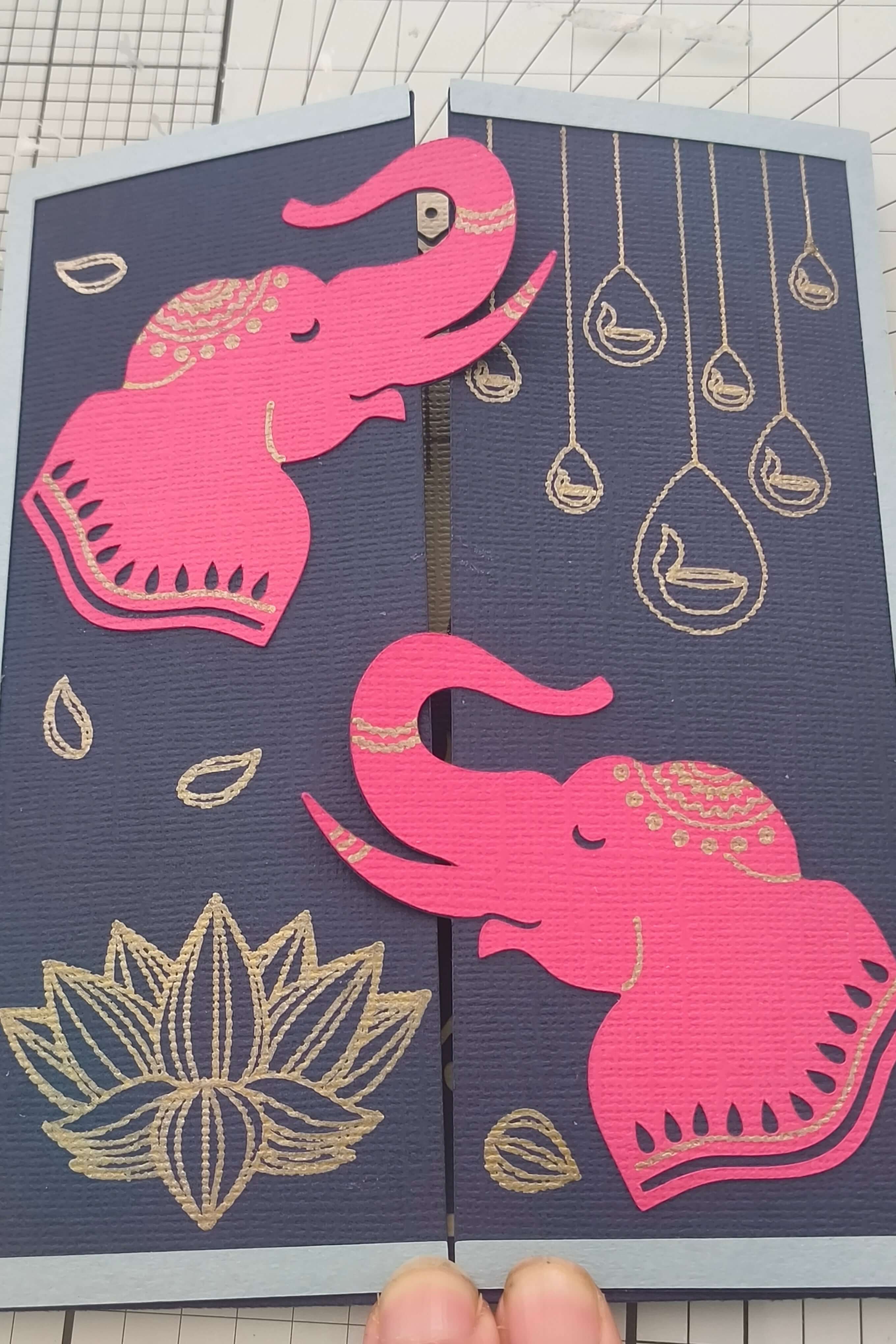 Handmade pink elephant Diwali card featuring intricate designs on navy background, perfect for celebrating the Festival of Lights.