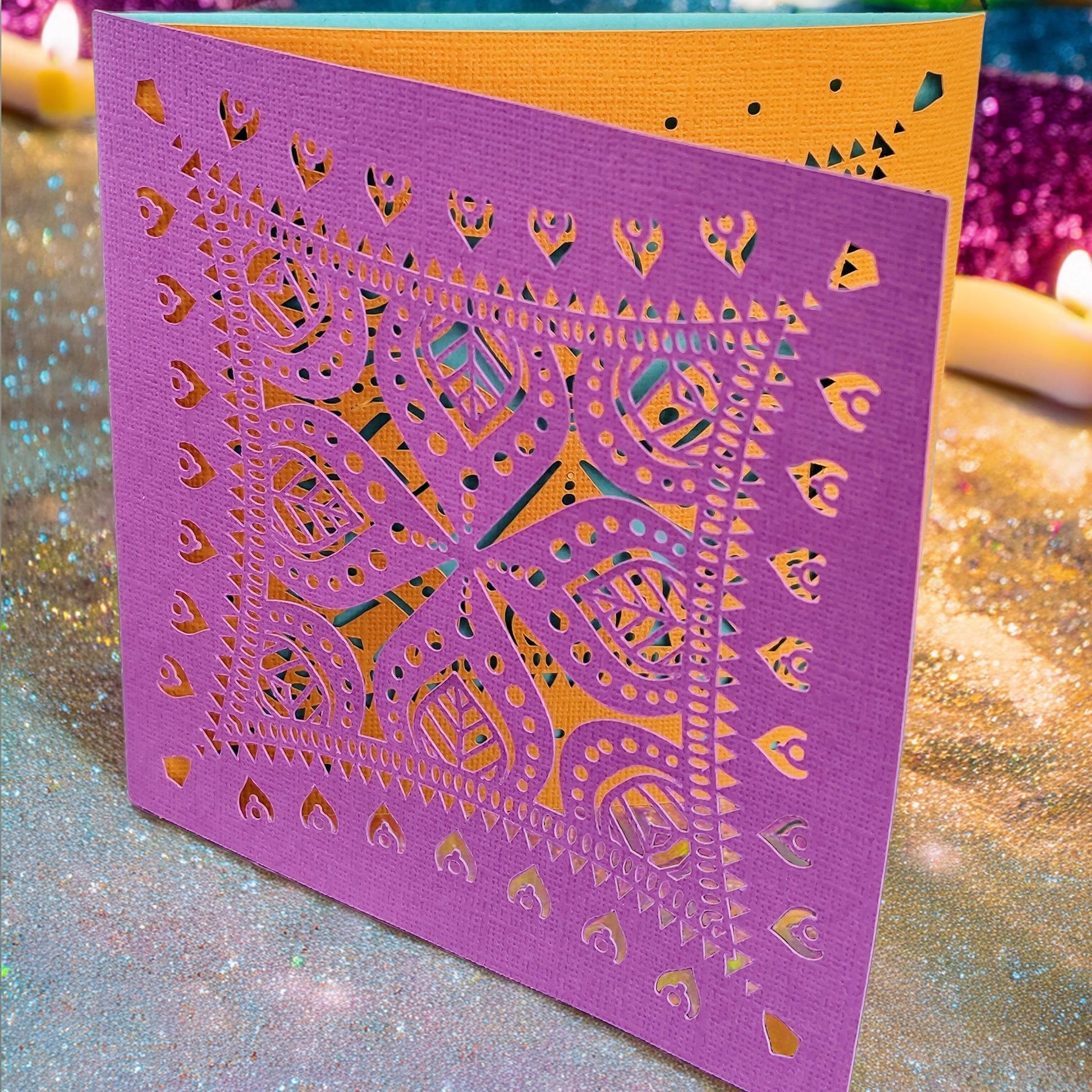 Personalised Diwali greeting card featuring vibrant layered rangoli design in pink and orange hues.