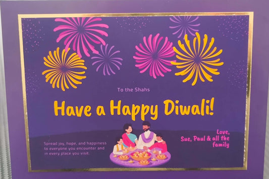Purple Diwali card with colourful fireworks and a family lighting diyas. Personalised message with festive wishes from loved ones
