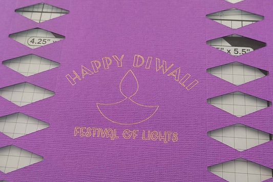 Gold foiled “Happy Diwali Festival of Lights” text with diya motif on textured purple cracker card.
