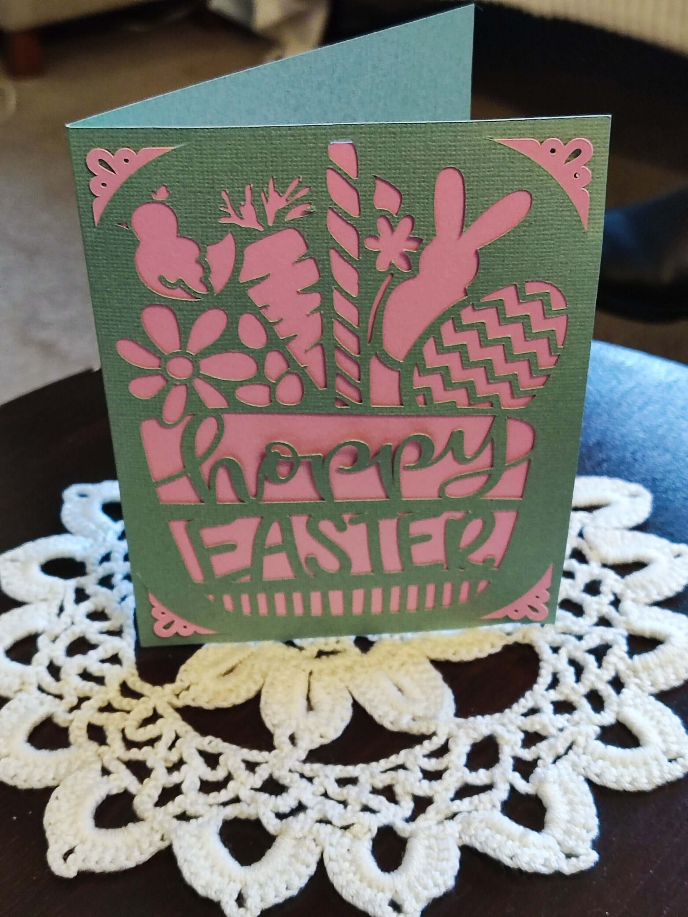 Handmade Easter greeting card in green and pink with bunny and spring designs, featuring 'Happy Easter' text.