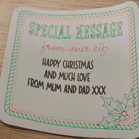Elf Special Message Sticker with festive border and holly sprig, personalised Christmas gift label reading “Happy Christmas and much love from Mum and Dad XXX”