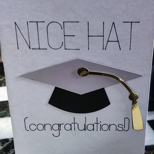 Funny handmade graduation card with 3D silver mortarboard and gold tassel reading "Nice Hat Congratulations"