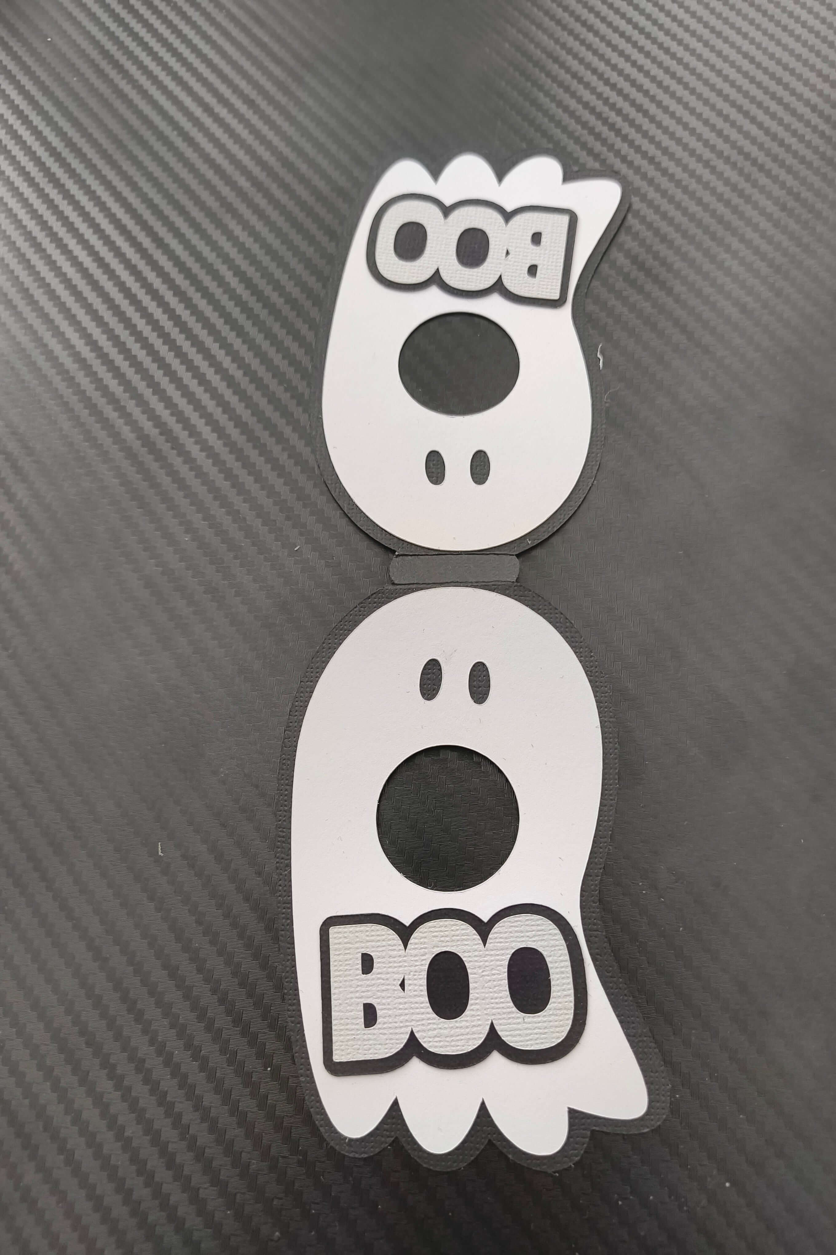 Two cute ghost-shaped Halloween tags with 'Boo' text, perfect for kids' treats and decorations.