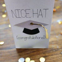 Funny handmade graduation card with 3D mortarboard cap, gold tassel, and "Nice Hat Congratulations" text.