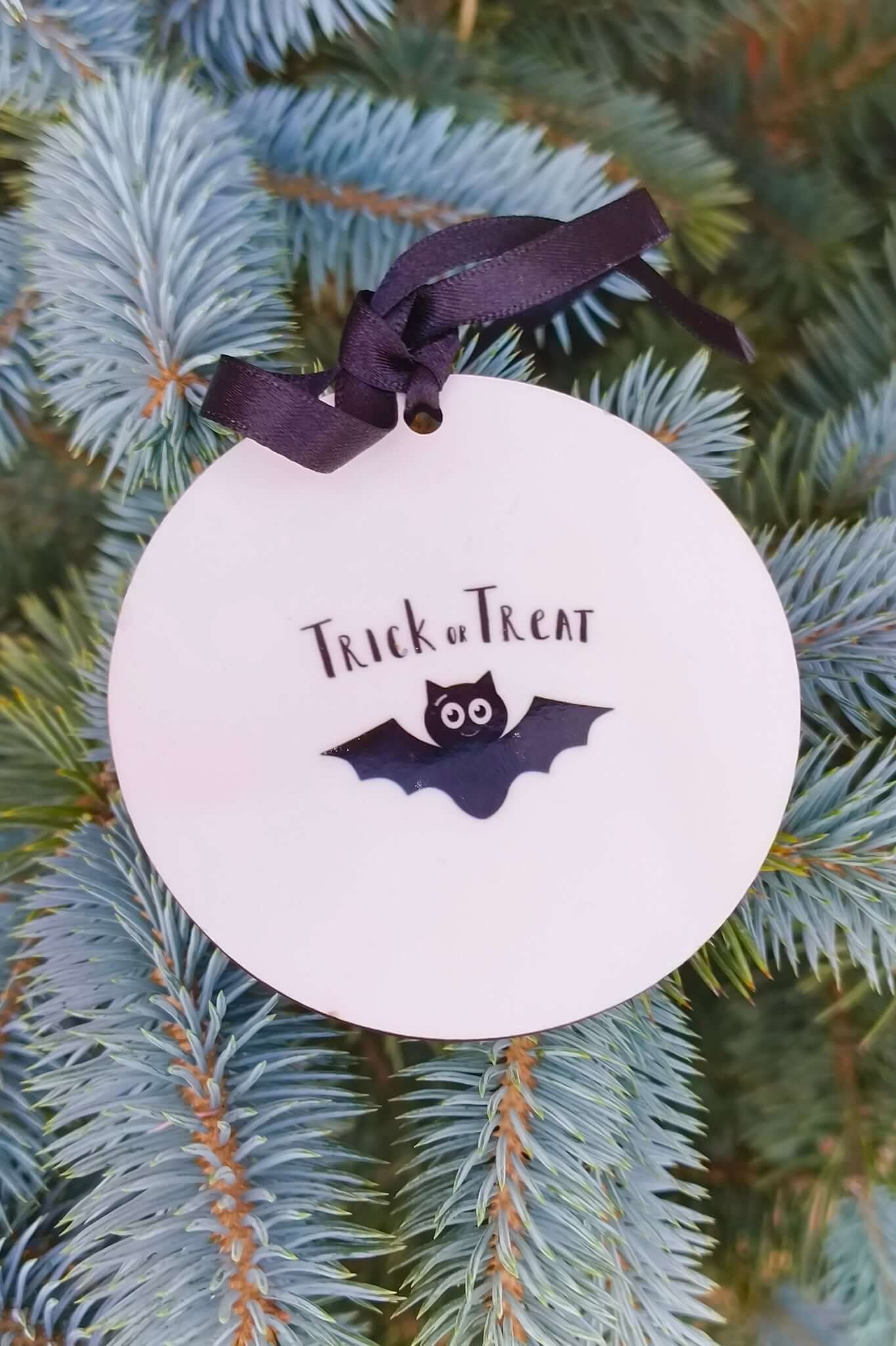 Halloween bat bauble with Trick or Treat text, personalised name and year, hanging decoration.