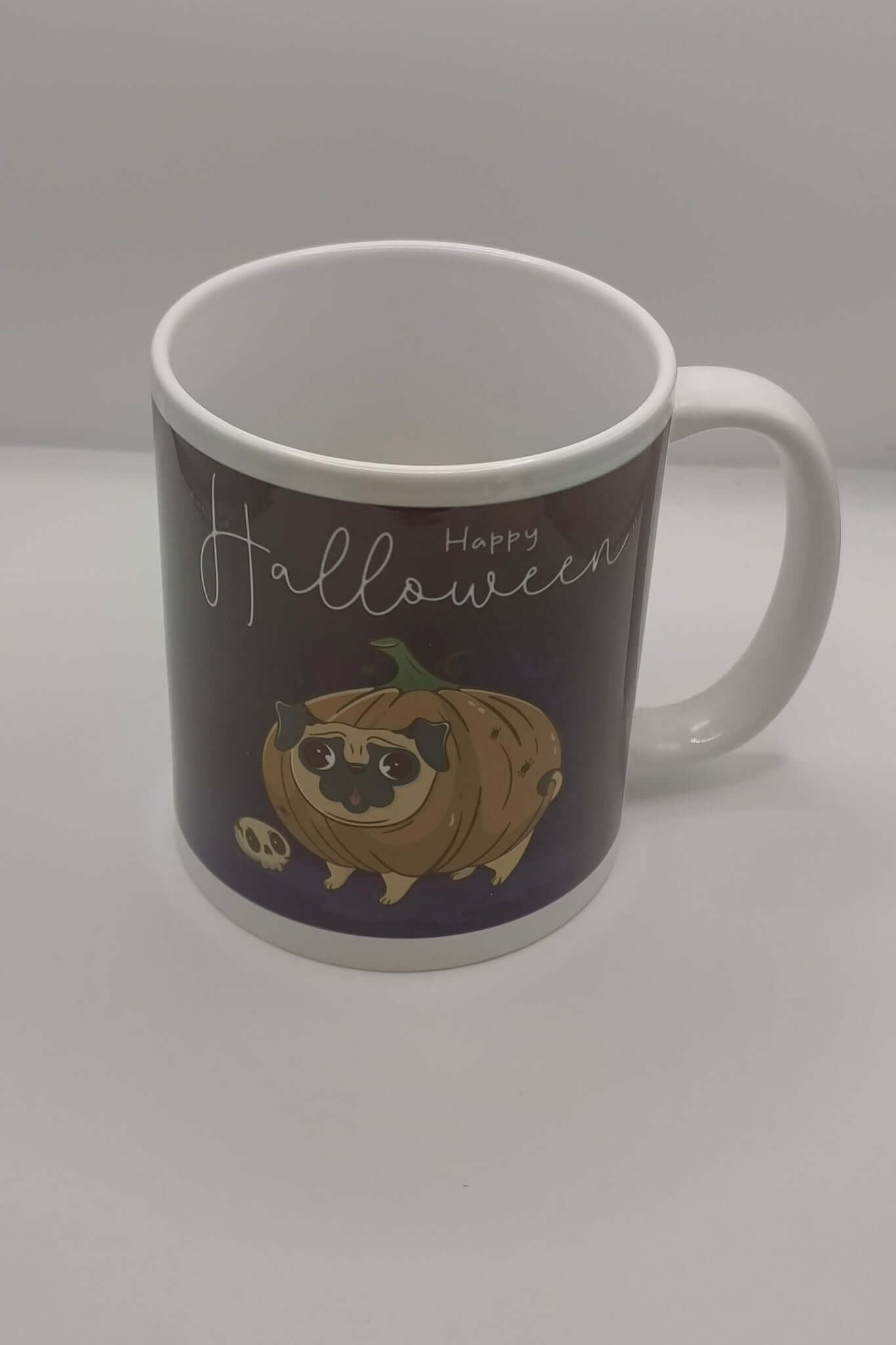 Halloween mug with pug pumpkin illustration on a clean white background, ceramic design ideal for spooky coffee mornings.