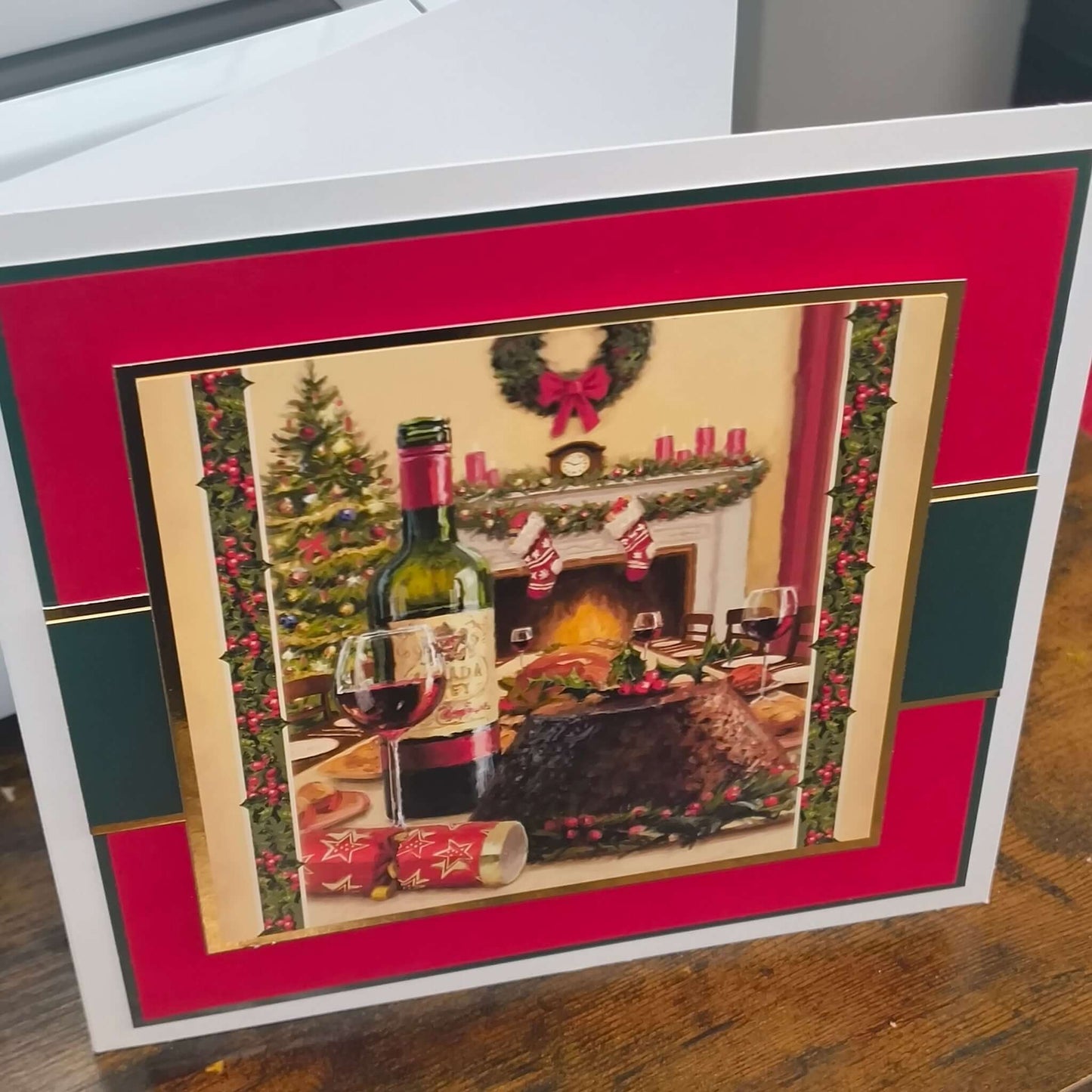 Personalised Christmas Card Festive Fireplace Scene featuring wine, Christmas pudding, and decorations.
