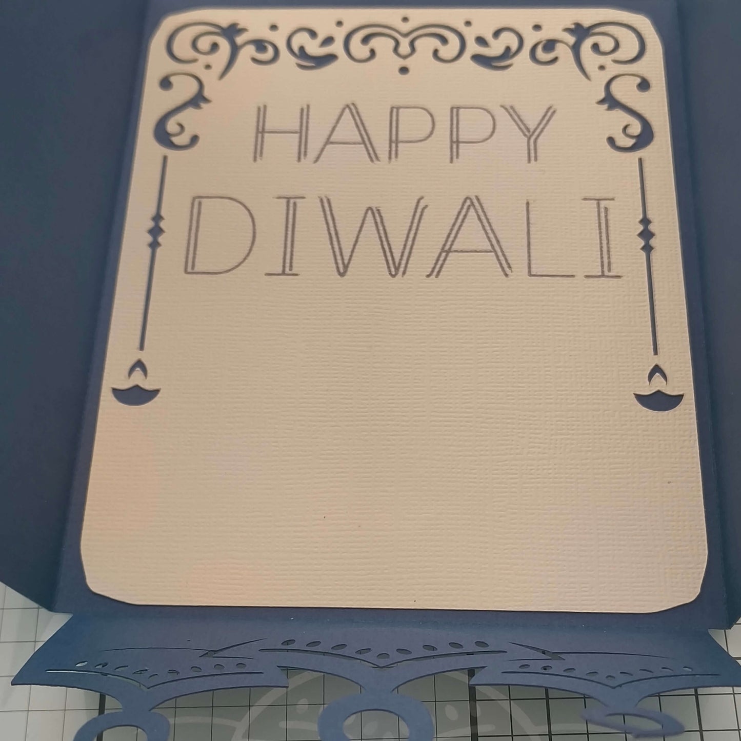 Inside view of a handmade Diwali card displaying the text 'Happy Diwali' in an elegant design.