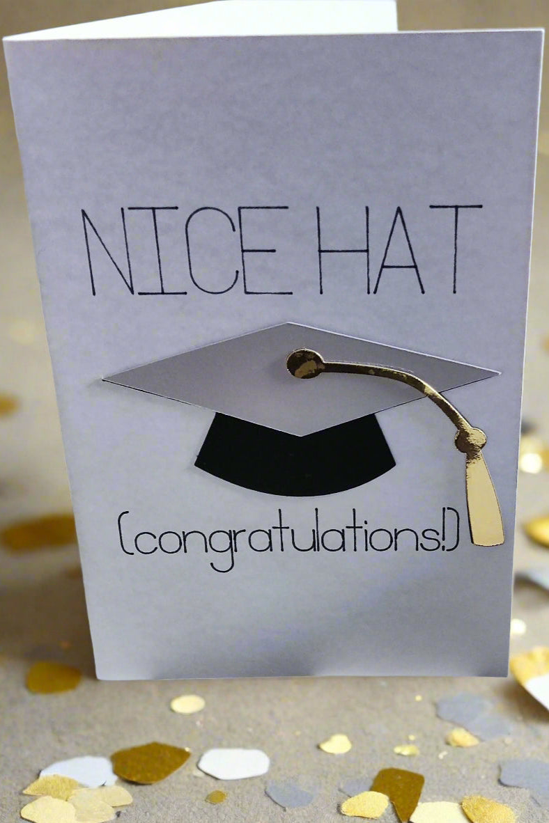 Funny handmade graduation card with "Nice Hat" text, 3D mortarboard cap, and gold tassel on white background