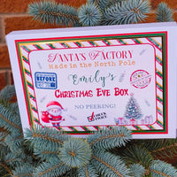 Personalised Christmas Eve box design featuring festive Santa graphic, child's name, and holiday decorations.