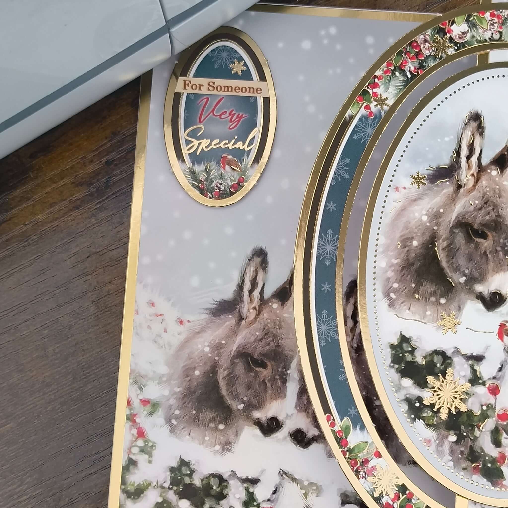 Handmade donkey Christmas card featuring a snowy scene and gold foiling for someone very special.
