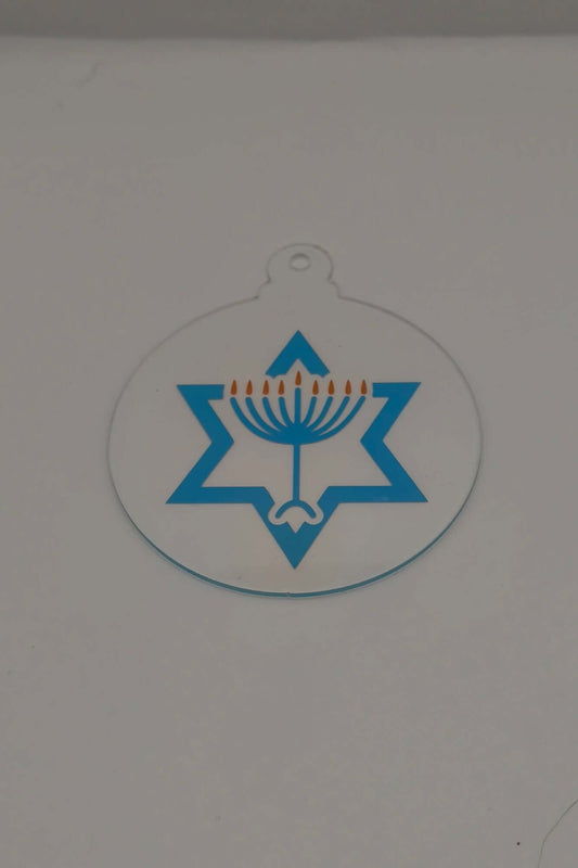 Clear acrylic Hanukkah ornament with a blue Star of David and gold menorah candles.