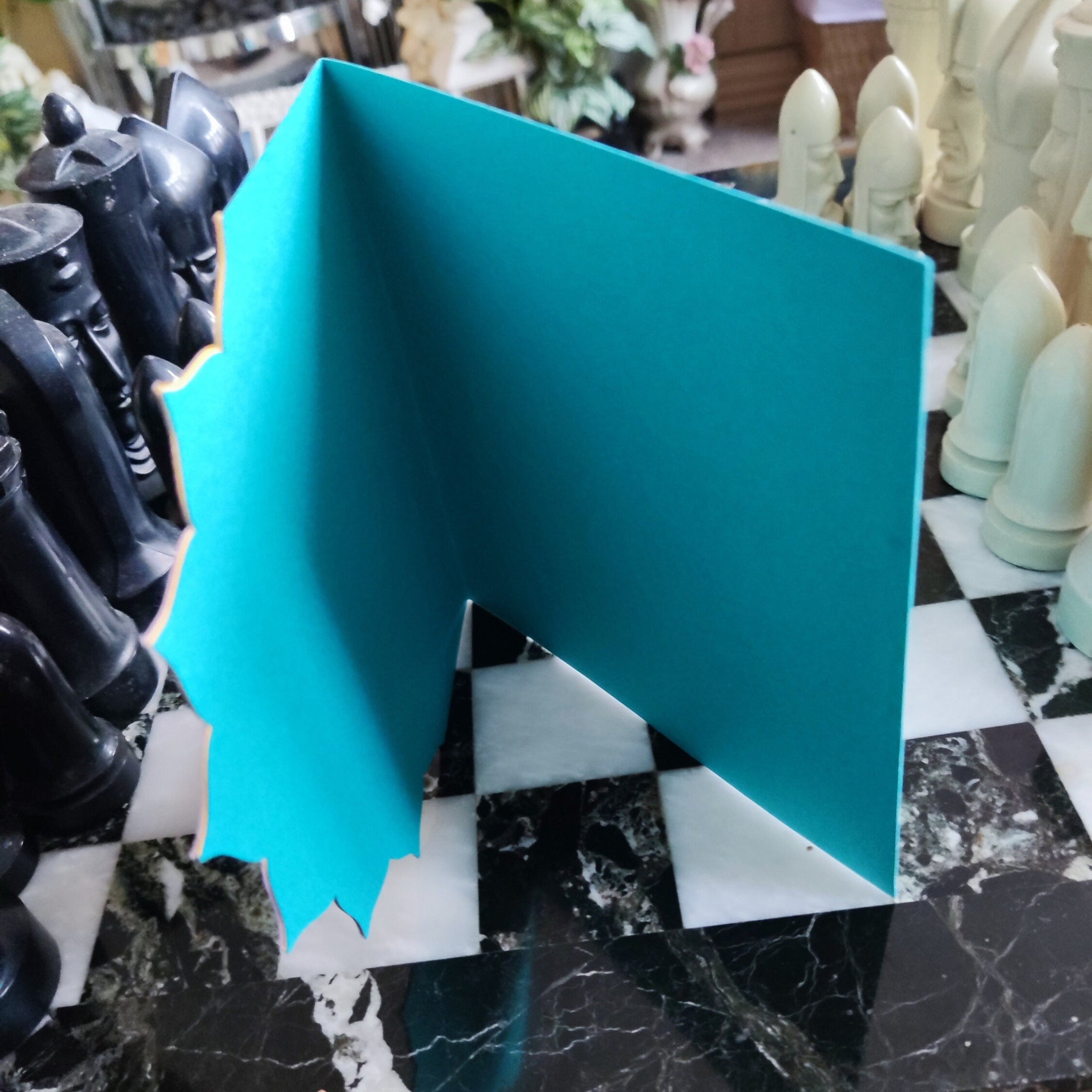 Inside view of the Diwali card, showing a clean teal interior ready for your personalised message.