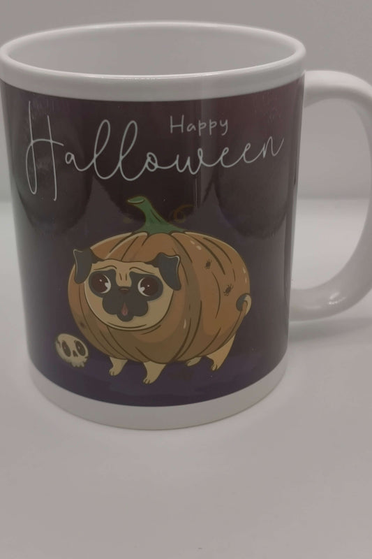 Happy Halloween mug showing cartoon pug dressed as a pumpkin, perfect autumn coffee mug or Halloween gift for dog lovers.