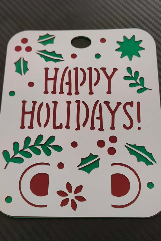 Handmade Happy Holidays money holder card with festive cut-out design in red and green.