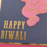 Personalised Diwali envelope featuring a Happy Diwali message with Ganesha design in gold and pink colors.