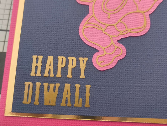 Personalised Diwali envelope featuring a Happy Diwali message with Ganesha design in gold and pink colors.