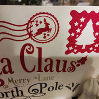 Personalised Santa Claus Envelope design featuring reindeer, Christmas tree, and North Pole address details.