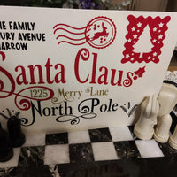 Personalised Santa Claus Envelope featuring family name and North Pole address design.