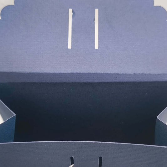 Interior view of handmade navy Ganesh gift box, with scalloped lid and ribbon slot closure, ideal for wedding or Diwali gifting.