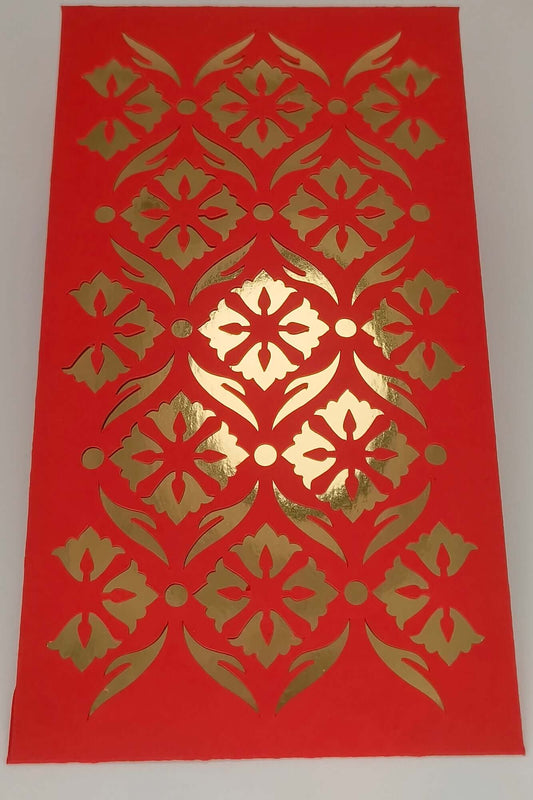 Close-up of luxury red envelope with gold foil cut-out floral pattern