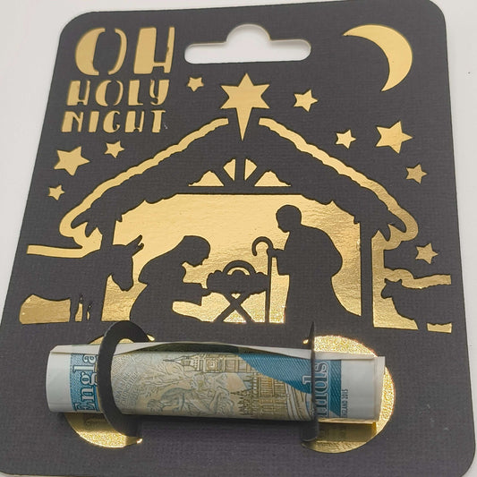 Close-up of Oh Holy Night nativity money holder card with gold foiled design and rolled note.