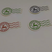 Set of North Pole Air Mail Christmas stickers in red, green, and black, shown on white background