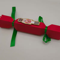 Flat side view of the cracker, with nutcracker motif centralised. Highlights length, proportions, and smooth finish.